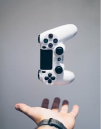 hand throwing controller up in the air